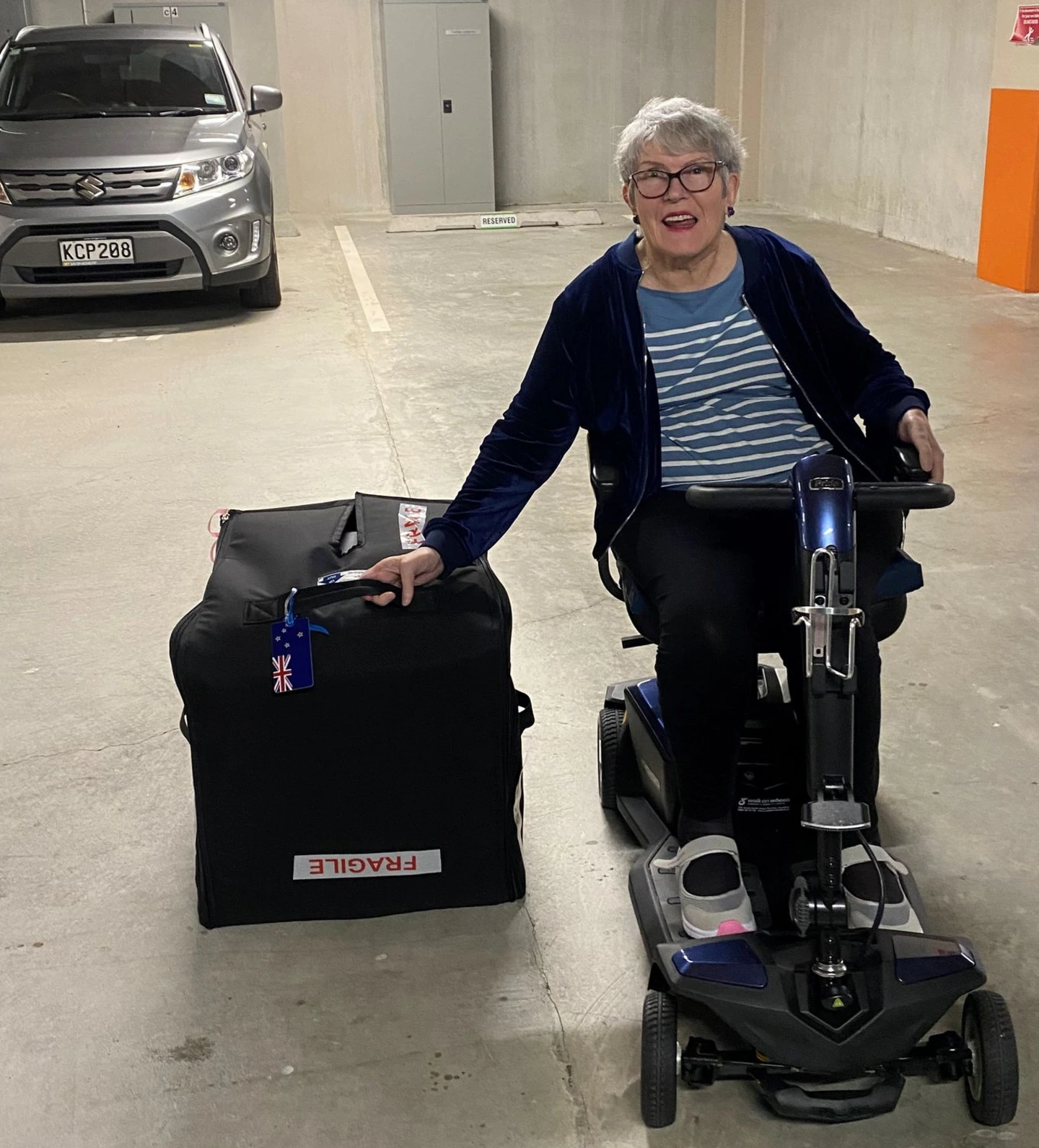 Maureen with her Kera Travel about to travel to the airport.